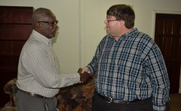 Minister of Citizenship, Winston Felix (left) and U.S. Charge d'Affaires Bryan Hunt.