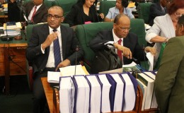 Former President Bharrat Jagdeo (left) in the seat of the Leader of the Opposition in Parliament. Next to him is PPP General Secretary Clement Rohee. (Keno George photo)
