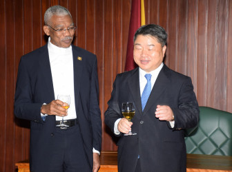 President David Granger (left) and South Korea’s non-resident Ambassador to Guyana, Maeng Dal Young in dialogue on Wednesday at the Ministry of the Presidency (Ministry of the Presidency photo) 