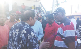 Prime Minister Moses Nagamootoo interacting with a resident at Whim yesterday.