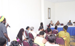 A participant engages the panel at the launching of the 2015 Violence Against Women campaign by The NGO Caribbean Development Foundation yesterday. (Photo by Keno George) 