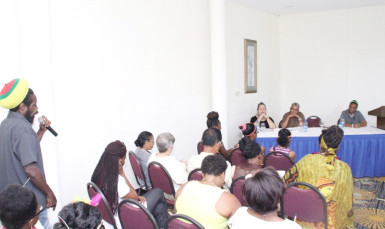 A participant engages the panel at the launching of the 2015 Violence Against Women campaign by The NGO Caribbean Development Foundation yesterday. (Photo by Keno George) 
