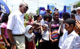 President David Granger as he interacted with children who attended the 21st annual Central Islamic Organisation of Guyana’s fun day at the MYO ground. (Ministry of the Presidency photo)