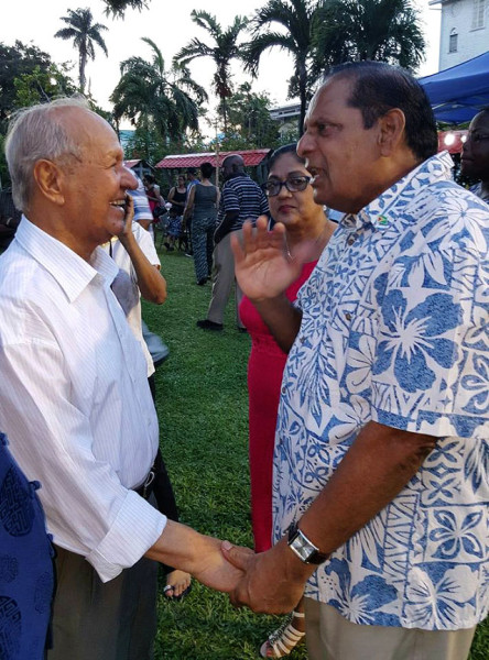 PM and Yesu Persaud: Prime Minister Moses Nagamootoo (right) greeting veteran businessman Yesu Persaud last evening at a fundraiser put on by the Indian Commemoration Trust at the Heritage Monument Park on Church Street. (Taken from the Prime Minister’s Facebook page) 