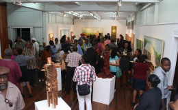 Art enthusiasts mingling at the opening of the exhibition of indigenous art paying homage to late Lokono priest and linguist John Peter Bennett and in honour of Indigenous People’s Month at the National Gallery of Art, Castellani House on Thursday. (Photo by Keno George)
