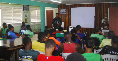 Top End Performance Gym Instructor and motivational speaker Kezqweyah Yisrael speaks with members of the Guyana Jags team.  