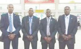 Guyana’s FIFA accredited referees from left to right Trevor Porter, Sherwin Johnson, Sherwin Moore and Venton Mars pose for a photo opportunity prior to their departure from the Cheddi Bharrat Jagan International Airport for the United States of America.