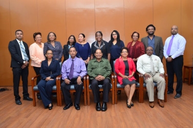 Newly appointed board members of Guyana National Newspapers Ltd (GNNL) and National Communi-cations Network (NCN) pose with Prime Minister Moses Nagamootoo. From left standing are: Sohan Poonai, Margaret Lawrence, Carolyn Walcott, Dhanwanti Sukhdeo, Dr Paloma Mohamed, Karen Davis, Scherazade Ishoof-Khan, Patricia Woolford, Ruel Johnson and Imran Khan.Sitting from left are: CEO of NCN Molly Hassan, NCN - Board of Directors Chair Bishwa Panday, Nagamootoo, GNNL Board of Directors Chair Jean La Rose and Chronicle General Manager Michael Gordon. Missing from photo are: Board Members Bert Wilkinson, Tabitha Sarabo, Mark Archer, Kojo McPherson and Colin Thompson.