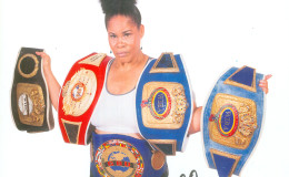 Gwendolyn O’Neil sporting the five belts she won during her career.