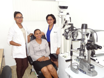 The company’s optometrists at eye testing equipment at the Grove operations 