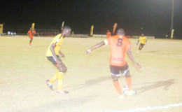 Action in the game between Slingerz FC and Alpha United in the Guyana Football Federation’s Stag Beer Elite League Friday night at the Leonora Facility. (Orlando Charles photo)

