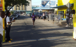 Cleveland ‘Little Kenyan’ Forde crossing the finish line all alone to regain the top honors of annual Courts 10K Run yesterday.