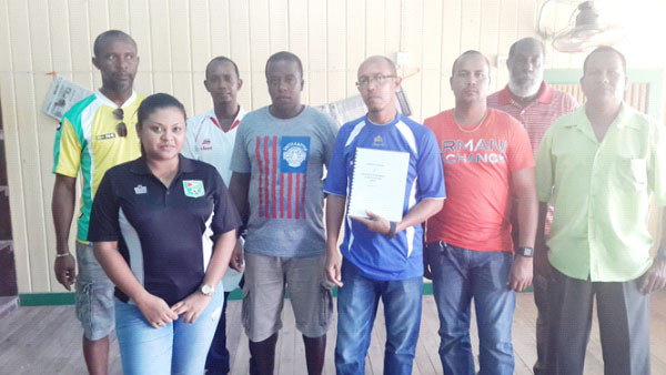 Members of the Bartica Football Association pose with Guyana Football Federation (GFF) General Secretary Richard Groden and Assistant General Secretary Diedre Davis following the adoption of their constitution. 