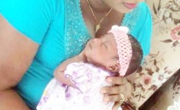 Omawattie Samaroo with her infant daughter 