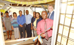 EU Ambassador Jernej Videtič (second right), Minister of Social Protection Volda Lawrence (third right) and others react as the ribbon is cut to officially open the centre. (EU Delegation photo)