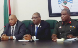 From left: Minister of Governance Raphael Trotman, Minister of State Joseph Harmon and Chief of Staff of the Guyana Defence Force Brigadier Mark Phillips at the press conference yesterday.