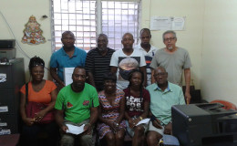 Acting President of the GFA Lavern Fraser-Thomas (sitting centre) posing with members of the executive committee and the participating club representatives following the conclusion of the entity’s constitutional adoption process.