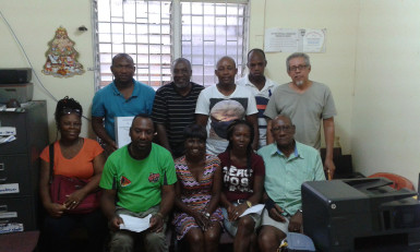 Acting President of the GFA Lavern Fraser-Thomas (sitting centre) posing with members of the executive committee and the participating club representatives following the conclusion of the entity’s constitutional adoption process.