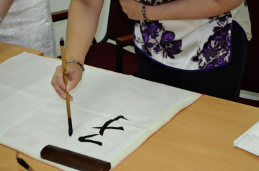  A member of the Confucius Institute displaying Calligraphy  