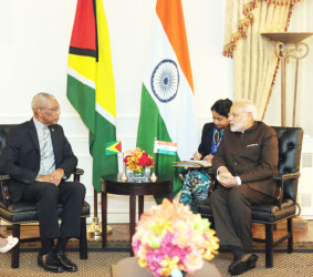 President David Granger in discussion with India’s Prime Minister Narendra Modi, whom he briefed on Guyana’s ongoing border controversy with Venezuela at the Waldorf Astoria Hotel, New York. (Ministry of the Presidency photo)