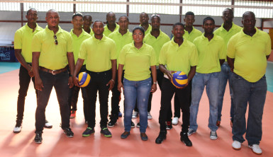 The national men’s volleyball team strike a pose with their coaches and team manager at the national gymnasium minutes before they departed for Brazil. 