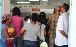Some members of the public waiting to pay their taxes at City Hall yesterday.
