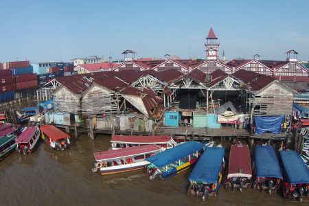 Water taxis parked around the dilapidated Stabroek Market Wharf. At serious risk to life and limb, several persons still vend on the wharf. (Photo by Keno George)