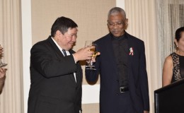 Toast! President David Granger (right) and  Mexico’s Ambassador to Guyana, Ivan Robero Sierra Medel toast to continued friendly bilateral relations between Guyana and Mexico (Ministry of the Presidency photo)