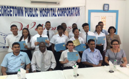 Orthopaedic Graduation: The ten students holding their certificates with coordinator Dr Kaaleshwar Ramcharran (seated at extreme left), and acting CEO of the GPHC Allan Johnson (seated second from left)