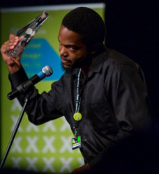 Kojo McPherson collecting his award for best project idea and pitch for a feature film at the trinidad+tobago film festival (ttff photo)