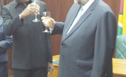 President David Granger shares a toast with newly-accredited United States Ambassador Perry Holloway yesterday
