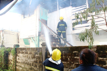 Fire-fighters extinguishing the blaze
