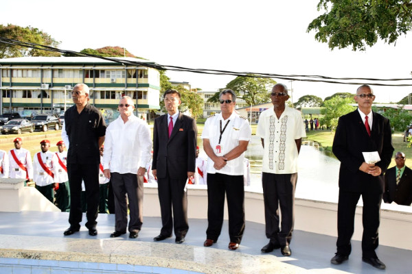 From left: President David Granger; Cuba’s Ambassador to Guyana, Julio César González Marchante; Ambassador designate from the Democratic People’s Republic of Korea, Pak Chung Yul; Honorary Consul for Barbados, Gerry Gouveia and brother of one of the victims, Rawle Thomas, Jeffery Thomas, at the wreath laying ceremony. (Ministry of the Presidency photo) 
