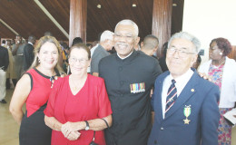 Malcolm Chan-A-Sue (right) was awarded the Golden Arrow of Achievement for long, dedicated and outstanding service in the field of aviation. Here he poses with President David Granger (second from right) and members of his family.