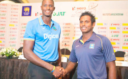 West Indies captain Jason Holder shakes hands with Sri Lanka captain Angelo Mathews at the official pre-series launch last night. (Cricinfo photo)