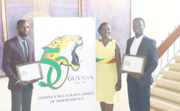Golden Jubilee logo: The winners of Guyana’s 50th Independence Anniversary logo competition, Christopher Taylor (right) and Compton Babb (left), pose with Junior Education Minister Nicolette Henry in front of their winning design. (Photo by Keno George)
