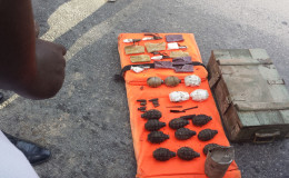 The grenades and ammunition found near the Lamaha Canal yesterday afternoon. Also shown is the green box in which in the weaponry was discovered. 