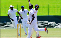 Fast bowler Kemar Roach celebrates after taking one of this two wickets on yesterday’s second day. (Photo courtesy WICB Media)