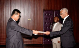 Newly accredited Non-resident Ambassador from the Democratic People’s Republic of Korea, Pak Chang Yul (left), as he presented his Letters of Credence to President David Granger at the Ministry of the Presidency (GINA photo)
