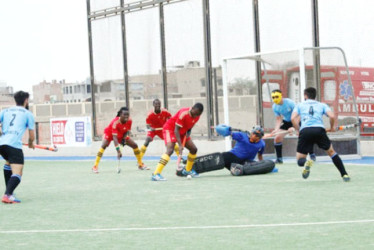 Guyana’s Aroydy Branford (centre) in the process of unleashing a shot on the Uruguay goal following a penalty corner during the team’s bronze medal matchup in the PAHF Challenge in Chicklayo, Peru. Photo compliments of PAHF Website. 