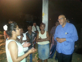 GWI Chief Executive, Dr Richard Van West-Charles (right) at the meeting with Bath Settlement residents. (GWI photo)  