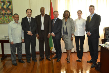 Minister of State Joe Harmon (third from left) with the EON team and Political Advisor Fred McWilfred (left)