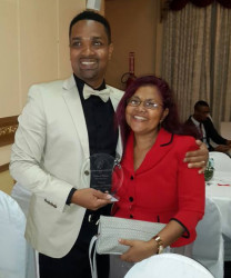 Richard Pitman and his mother Amaya Jaikaran after he won the Guyana Business Coalition on Health Awareness Media Award last year.