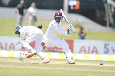 Denesh Ramdin drives through the off-side during his knock of 23 in the first innings against Sri Lanka on the third day of the opening Test here Friday. (Photo courtesy WICB Media)  