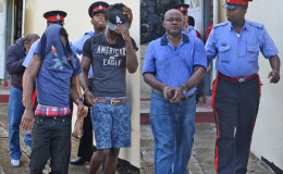 The four Guyanese men leaving court after the charges were read to them. (Grenada Informer photo)