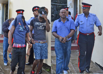 The four Guyanese men leaving court after the charges were read to them. (Grenada Informer photo)