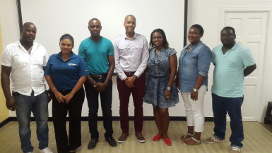 GFF Chairman Clinton Urling (centre) and GFF General Secretary Diedre Davis (2nd from left) posing with members of the new GBSA executive Adrian Alleyne (right), GBSA President Rollan Tappin (3rd right), Lashaun Martindale (3rd left), Rashauna Rollins (2nd left) and Dwallon Farrell (2nd left).
 

