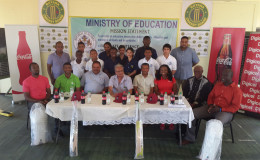 A few students, members of the GCB executive panel, Minister of Education Dr Rupert Roopnaraine (centre) and sponsors from Digicel and Banks DIH at yesterday’s launch of the nationwide schools cricket league. 