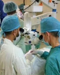 Dr Joseph Pasternak guides Dr. Shailendra Sugrim, Head of the GPHC’s Ophthalmology Department, during a corneal transplant surgery. (GPHC photo) 