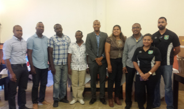 Newly elected GFA President Clifton Hicken (4th left) posing with members of the newly elected executive inclusive of Aaron Fraser (left), Frank Parris (2nd left), Lloyd Millington (3rd left), Althea Scipio (4th right), Charles Greaves (3rd right) while GFF Normalization Committee Chairman Clinton Urling (centre), GFF General Secretary Diedre Dave (2nd right) and Normalization Committee member Tariq Williams (right) share the moment.